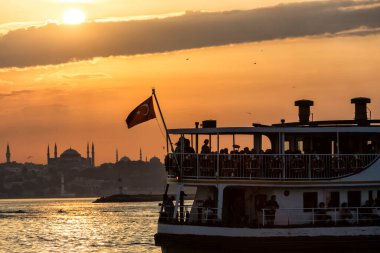Istanbul, Turkey-October 27, 2018: silhouettes of boats on the Bosphorus at the sunset