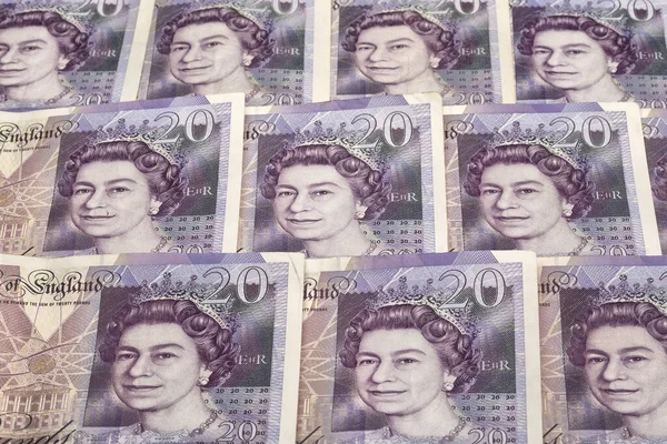 UK pound,money of United kingdom close up on white, Pound UK note. Background British currency conceptualised by a close up of the notes of the United Kingdom