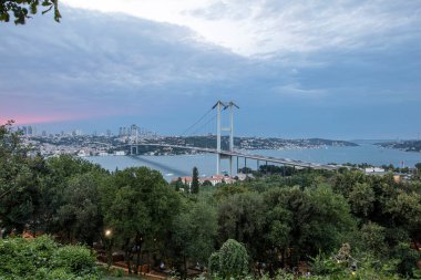 Bosphorus bridge in Istanbul Turkey - connecting Asia and Europe. Evening, long exposure. clipart