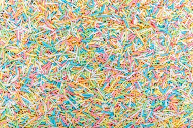 Şeker parçacıkları, pasta ve pasta süslemeleri, arka plan olarak bir sürü serpiştirme.