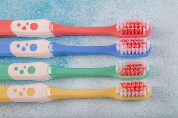 Toothbrush Color Four Pieces Blue Wooden Background — Stock Photo, Image