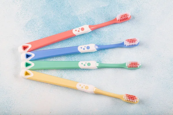 Toothbrush Color Four Pieces Blue Wooden Background — Stock Photo, Image