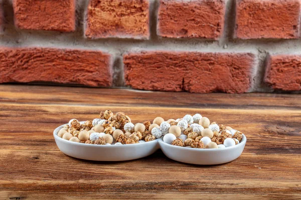 Roasted chickpeas in white cup on hardwood.The Turkish name is leblebi.