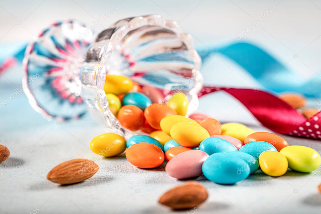 Almond candy; Sugared Almonds on white background.