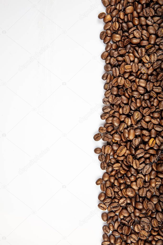 Roasted coffee beans background. Coffee on grunge wooden background