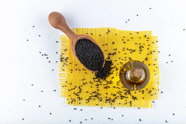 Black Cumin Seeds Essential Oil Bowl Wooden Shovel Spoon Nigella — Stock Photo, Image