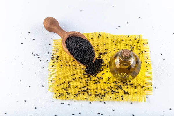 Black Cumin Seeds Essential Oil Bowl Wooden Shovel Spoon Nigella — Stock Photo, Image