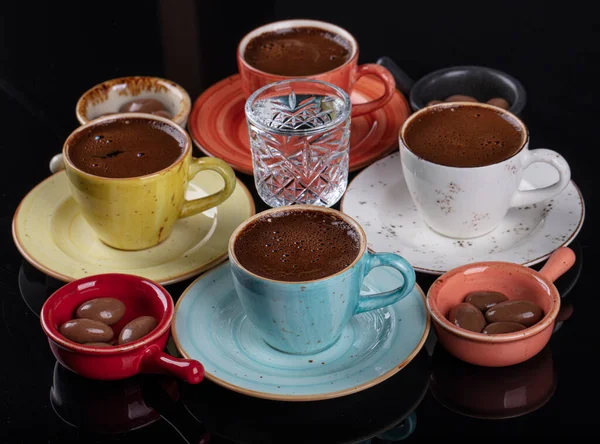 Traditional Turkish Coffee. Turkish coffee cup set isolated on black background.