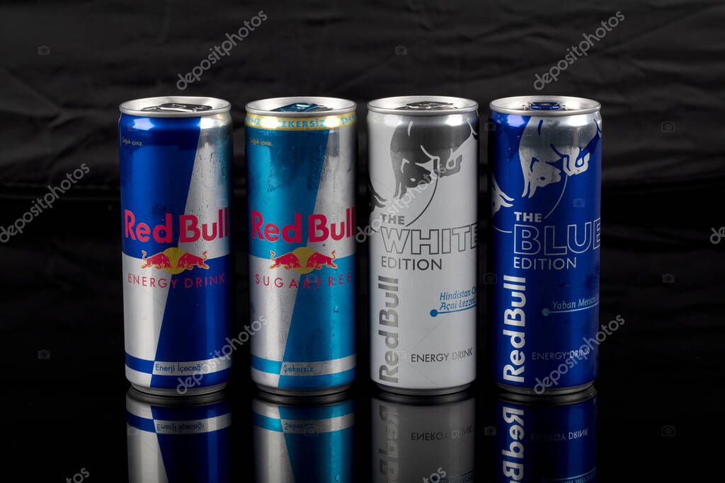 Istanbul, Turkey - August 25, 2020; Aluminum can of RedBull drink with water drops over dark background. Red Bull is the most popular energy drink in the world.