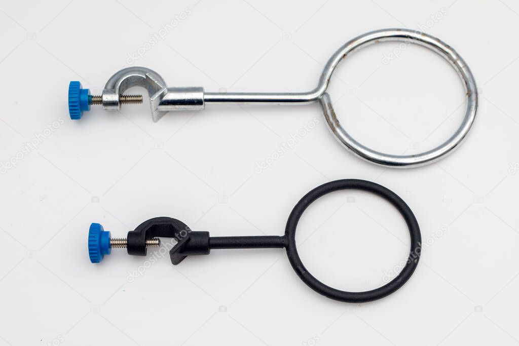 Clamp holder. Laboratory equipment. Ring clamp are used to place separating funnel and glass funnel. In a chemical laboratory.