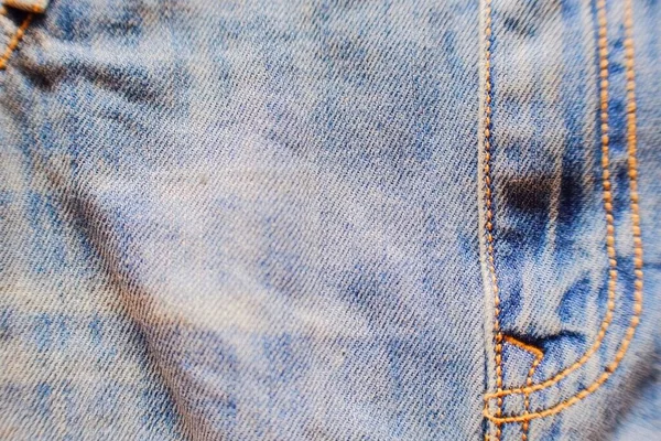 ライトブルーのジーンズのテキスタイルの背景の写真を閉じます 正面図 — ストック写真