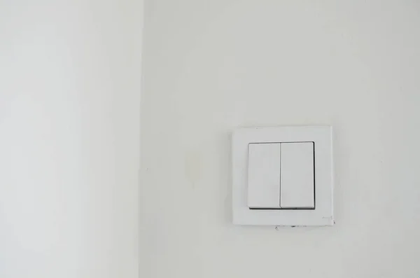 white light switch with white wall
