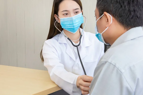 Doctor check body with stethoscope at a hospital