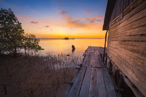 Amazing sunrise at the Sembulang Batam fishing village, the pier  harbor , fishing boats