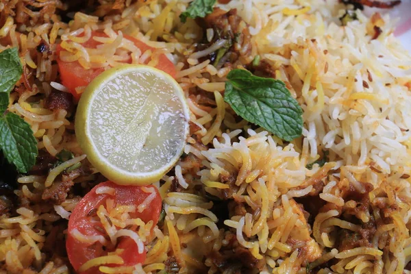 Veg dum Biryani with lemon and mint leaf