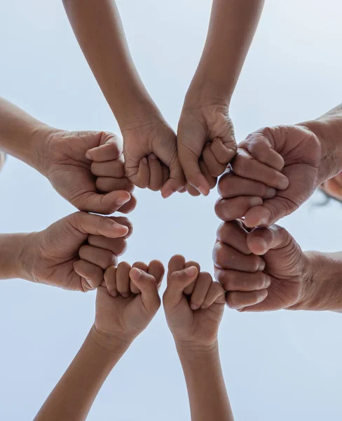 Asian family standing hands support together. Family generation join hands showing unity and teamwork.