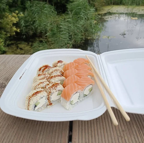 Picnic in nature.Sushi set. Sushi menu. Japanese food. — Stock Photo, Image
