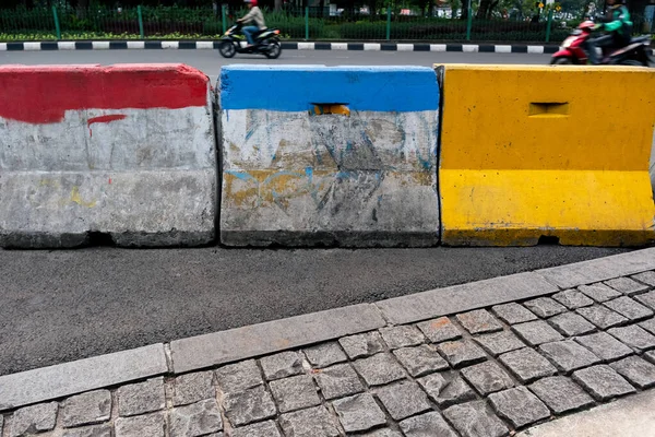 colorful painted barriers for traffic control in Jakarta, Indonesia