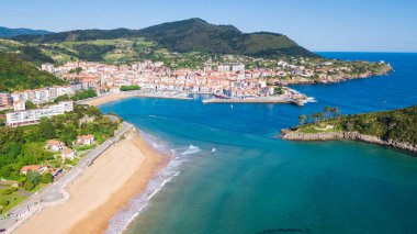 aerial view of basque fishing town and its coastline clipart