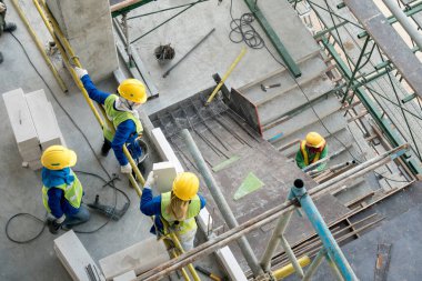 Top view construction worker in construction site clipart