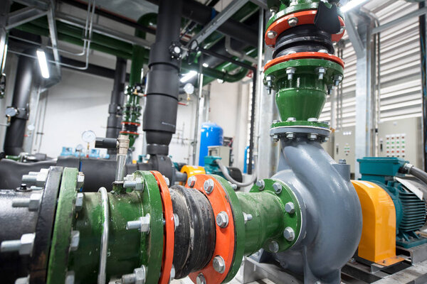 interior of large industrial factory, steel pipelines and valves          