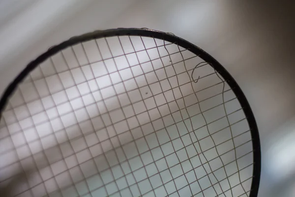 Wired tennis racket. Sports played with the ball