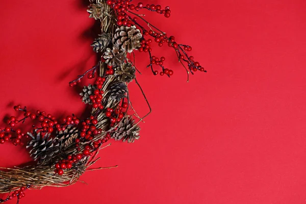 Handmade Christmas wreath on red background — Stock Photo, Image