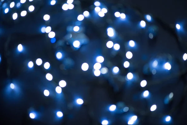 Μπλε φόντο γιρλάντα Χριστουγέννων bokeh — Φωτογραφία Αρχείου