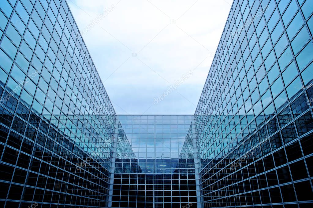 Modern futuristic building with glass facade.