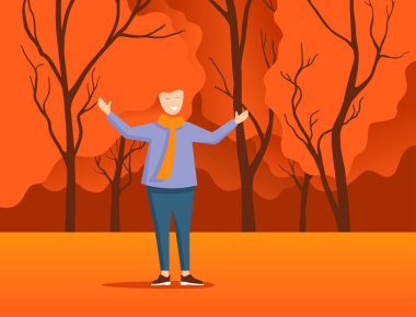 Sonbahar parkındaki mutlu kızıl saçlı genç kadın