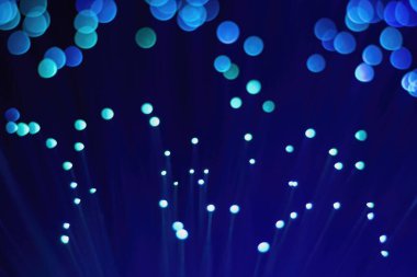 Mavi arkaplanda soyut bulanık ışık