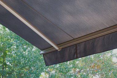 Sunprotecting awning from fabric material clipart
