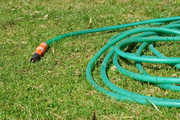 Watering hose on the lawn