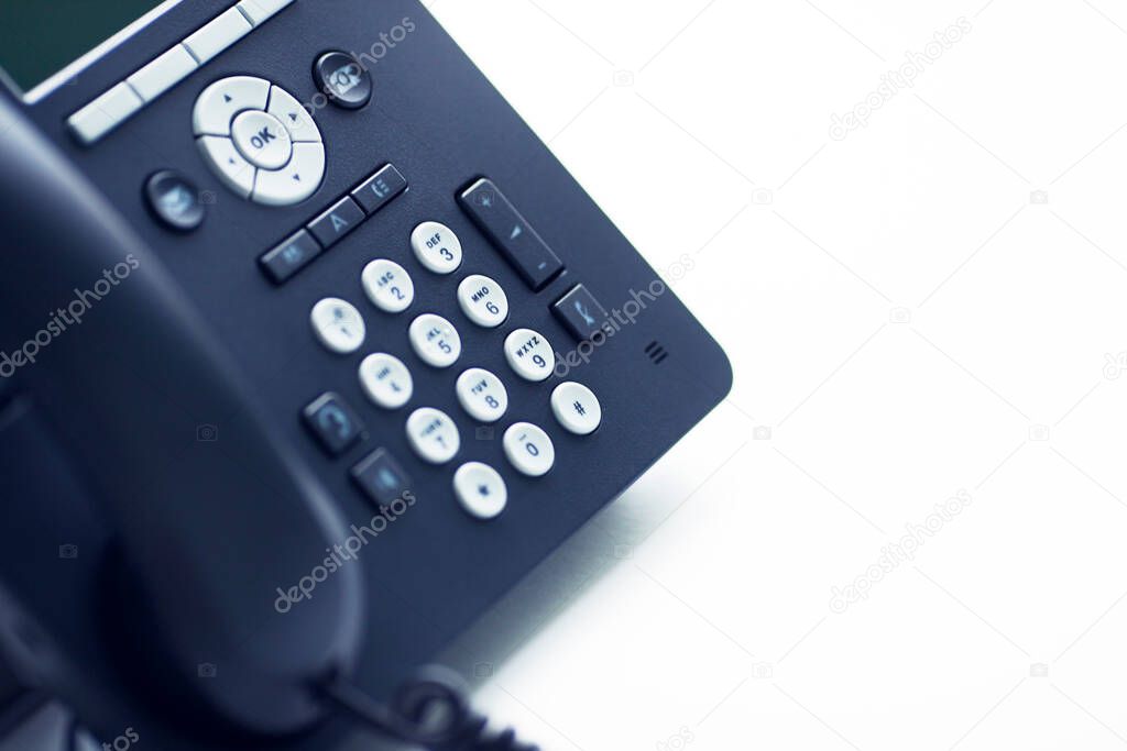 Deskphone, office and business concept. New ip phone with buttons and big display for communication without interference. Top view. Space for a text. Close up.