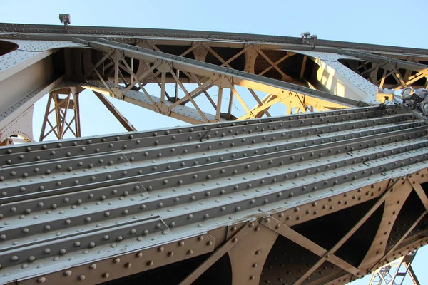 stock image A view from below of the struts and posts connecting the two arched belts of the bridge span. Close-up of the rivets