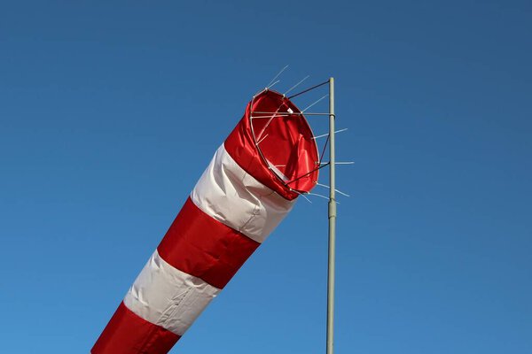 Close-up of the windsock against the blue sky 