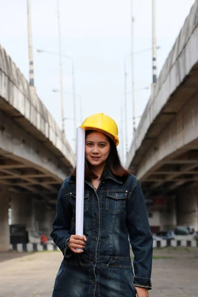 Female Civil Engineer Architect Yellow Helmet Standing Project Drafts While Royalty Free Stock Photos