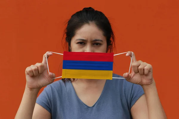 Woman Armenia Flag Hygienic Mask Her Hand Lifted Front Face — Stock Photo, Image