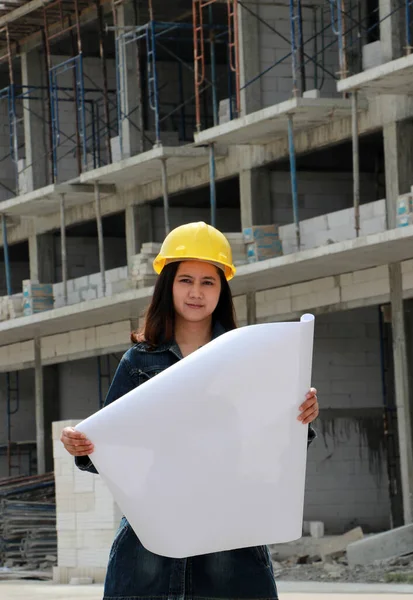 Female Civil Engineer Architect Yellow Helmet Standing Project Drafts While Royalty Free Stock Images