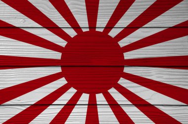 Japon İmparatorluk Ordusu 'nun savaş bayrağı Fiber çimento duvar arkaplanına boyanmış. Yükselen Güneş Bayrağı.
