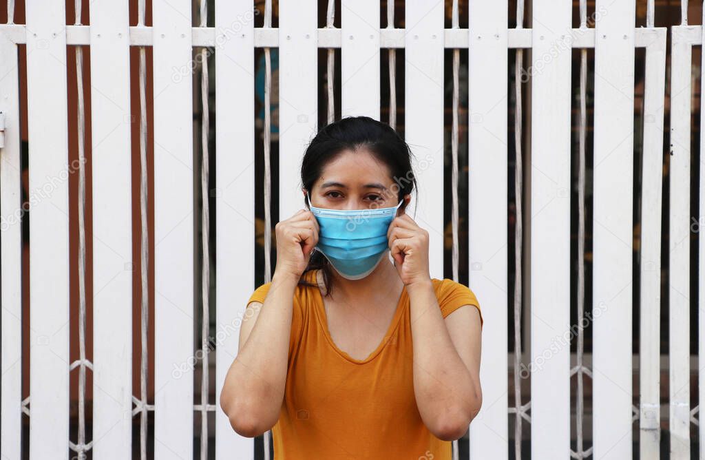Asian woman wearing the mask for prevent germs. Tiny Particle or virus corona or Covid 19 protection. Concept of Combating illness.