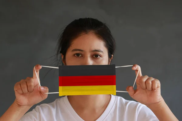 Woman White Shirt Germany Flag Hygienic Mask Her Hand Lifted — Stock Photo, Image