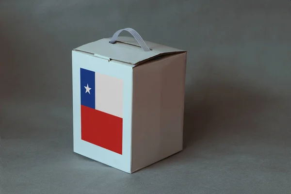 Chile flag on white box, Paper packaging for put products. The concept of export trading from Chile.