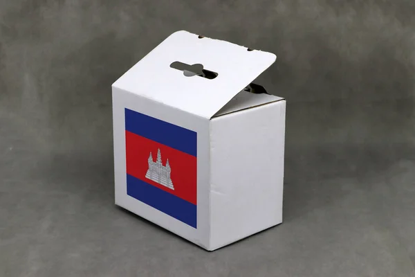 Cambodian flag on white box, Paper packaging for put products. The concept of export trading from Cambodia.