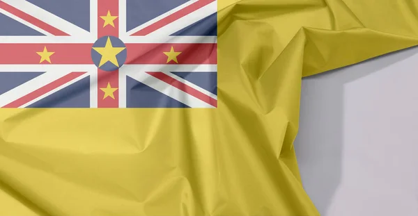 Niue Stof Vlag Crêpe Vouw Met Witte Ruimte Een Gouden — Stockfoto