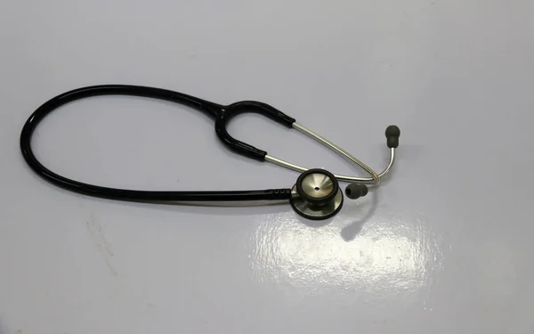 Medical Headphones or earphone for doctor on the white floor.