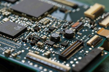 Elektronik arka plan teknolojisi yeşil devre kartını kapatıyor. Uygulama Özgül Bütünleşik Devre.