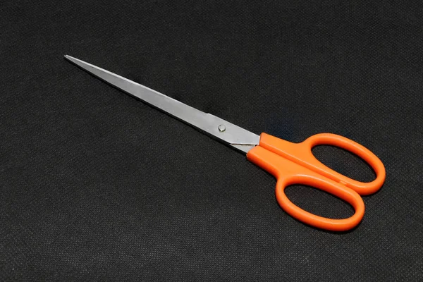 Metal Scissors Orange Handle Put Black Background Instrument Used Cutting — Stock Photo, Image