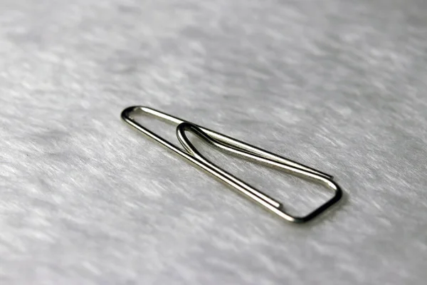 One Paperclip Put White Fabric Floor Piece Bent Wire Plastic — Stock Photo, Image