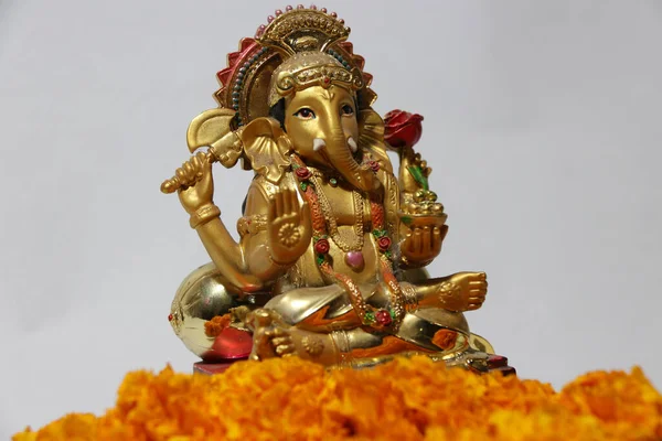 Ganesha Made Brass Foreground Yellow Marigold Flower White Background Son — Stock Photo, Image